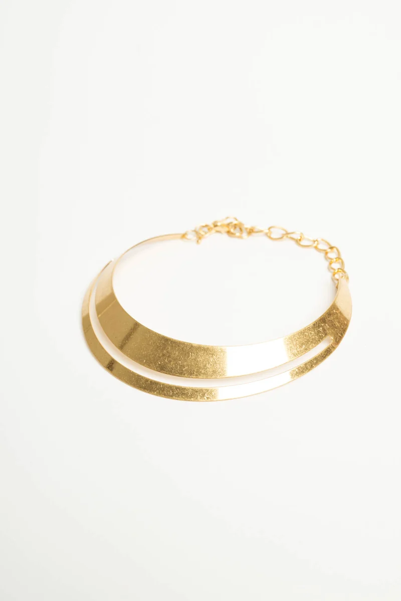 Collana rigida in metallo dorato