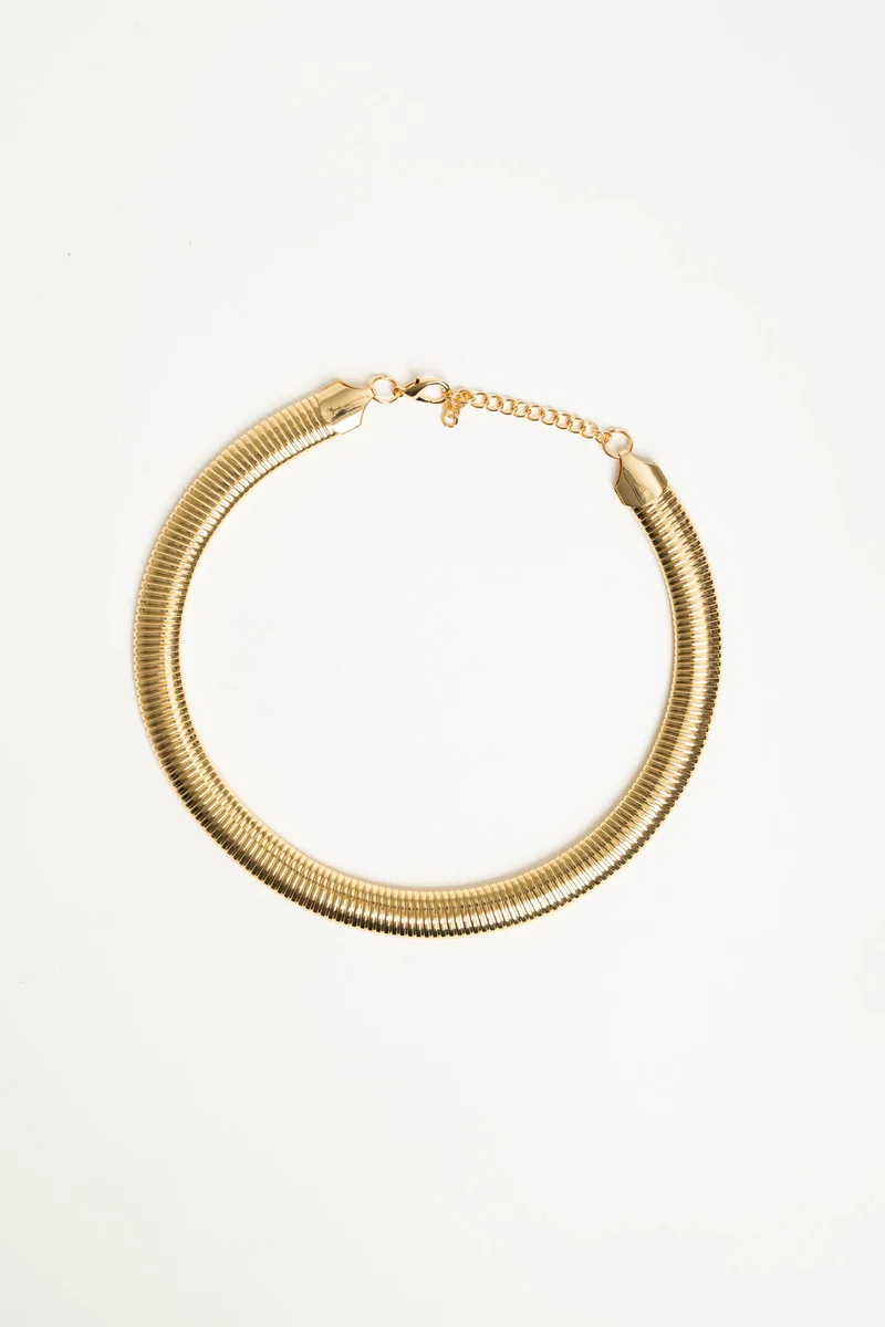 Collana rigida in metallo dorato