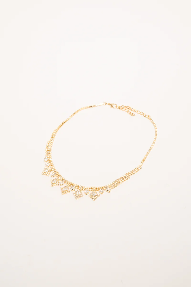 Collana in metallo dorato con pendenti in strass