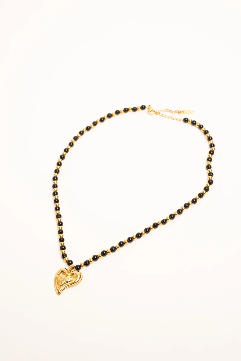 Collana con perline e pendente a cuore oro