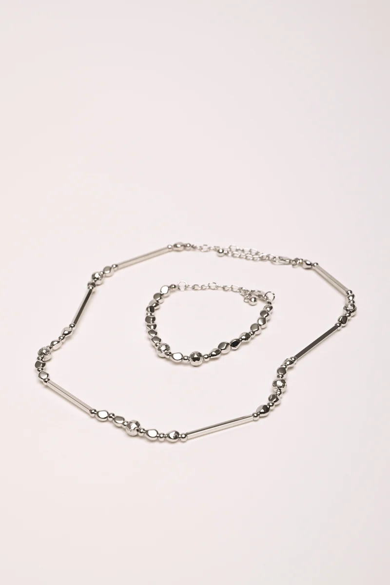 Set collana + bracciale in metallo